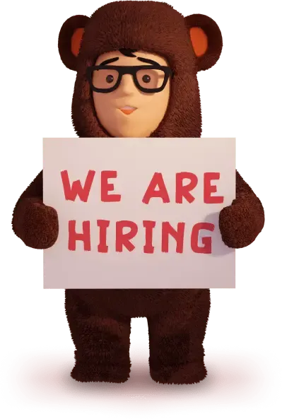 Kevin holding a 'we are hiring' sign